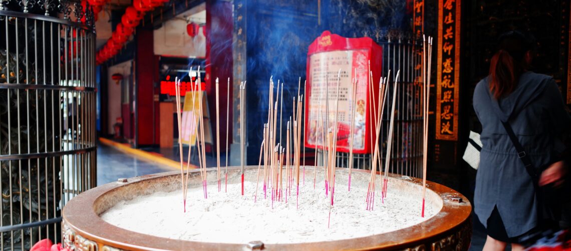Photo of praying with incense.